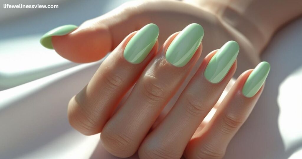 "Mint green summer nails, refreshing 2025 manicure idea for tropical vacation outfits."