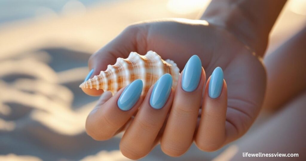 "Sky blue summer nails, ocean-inspired manicure trend perfect for poolside style."